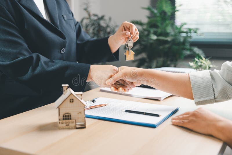 Professional handshake closing a real estate deal